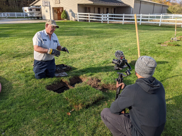 Tom Frank, owner of Tim Frank Septic Company in Huntsburg, Ohio, provides a demonstration of how a diverter box should work